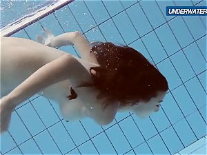 amateur Lastova resumes her swim